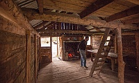 Marcus checks out the inside of Jamieson Hut